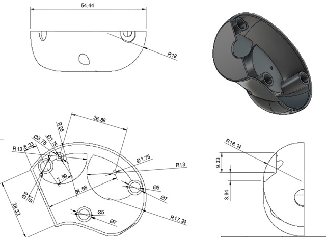 Wind-up monkey toy disassembled on table